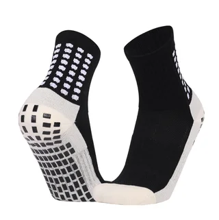 Black and cream crew football grip socks shown from the side and sole, with rectangular raised grip pads