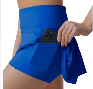 Blue sports skort lifted to show fitted inner shorts and a thigh pocket holding a phone