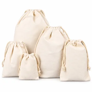 Natural cotton drawstring pouches in five sizes with cream cords on a white background