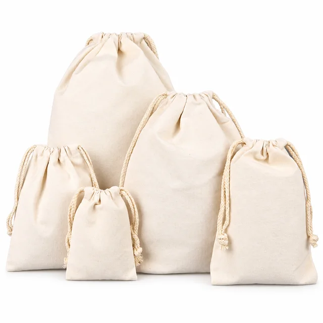 Natural cotton drawstring pouches in five sizes with cream cords on a white background