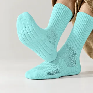Unbranded customization mockup of mint-blue crew sports socks with ribbed cuffs and cushioned knit soles