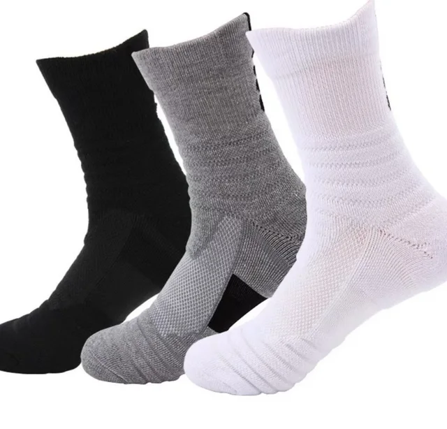 Men's crew sports socks in black, gray and white showing ribbed cuffs and mesh-knit insteps