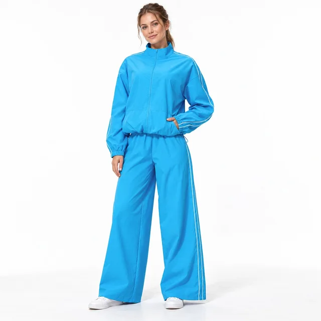 AI-assisted visualization of a women's bright blue zip jacket and wide-leg tracksuit set